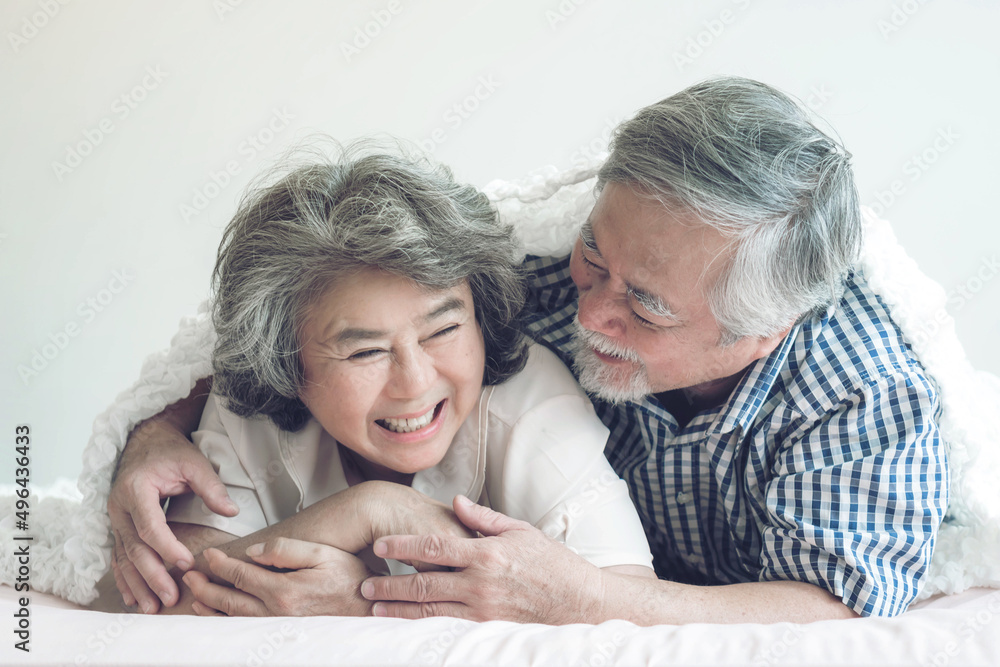 Happy love Elderly couple smiling , Senior couple old man and senior woman hugging in bed room - lifestyle senior concept Happy love Elderly couple smiling , Senior couple old man and senior woman hugging in bed room - lifestyle senior concept