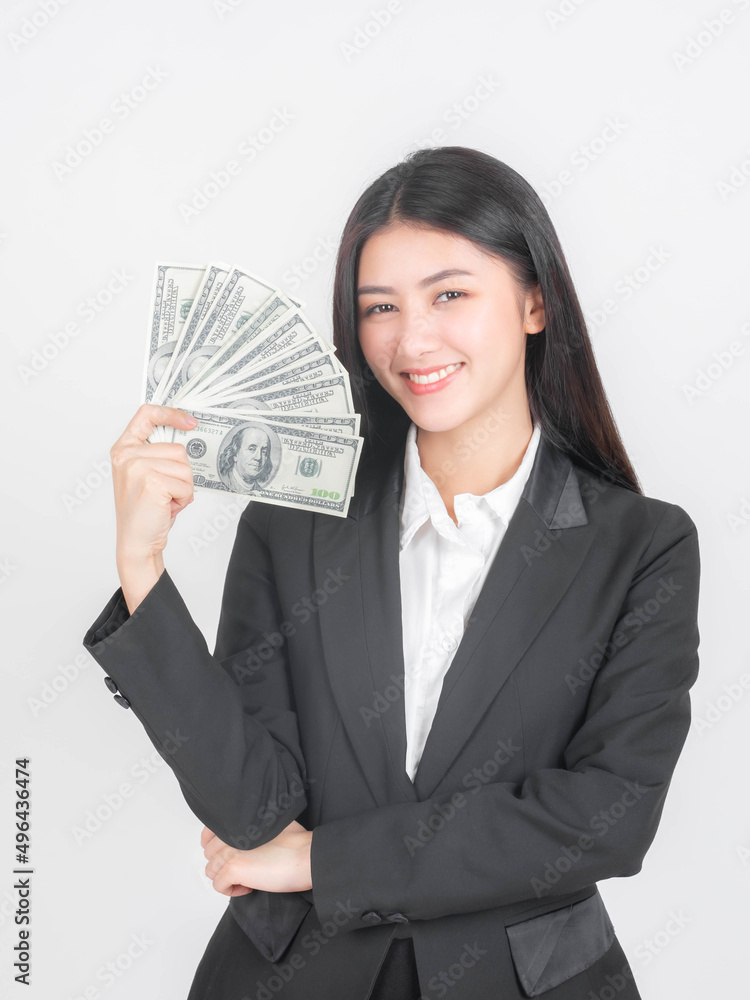 Successful beautiful Asian business young woman holding money US dollar bills in hand , business concept Successful beautiful Asian business young woman holding money US dollar bills in hand , business concept