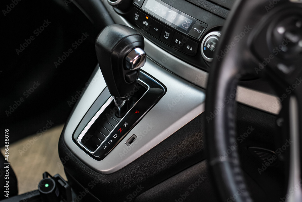 automatic transmission shift selector in the car interior. Closeup a manual shift of modern car gear shifter. 4x4 gear shift