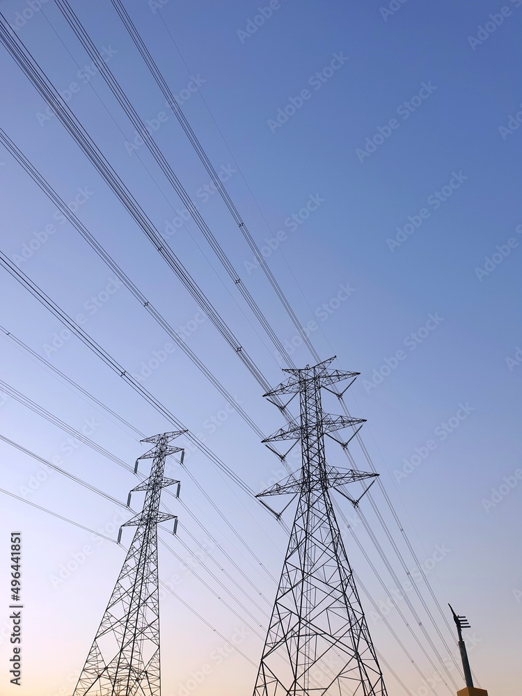 Electric tower on blue sky and clounds as a background, High voltage tower in large construction site, Space for text in template, Electric tower on blue sky and clounds as a background, High voltage tower in large construction site, Space for text in template,