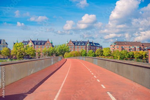 Canvas Print Pedestrian and bicycle bridge across the railways takes towards residential buildings