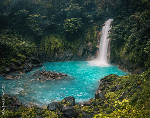 Waterfall and natural pool with turquoise water Rio Celeste  Costa Rica