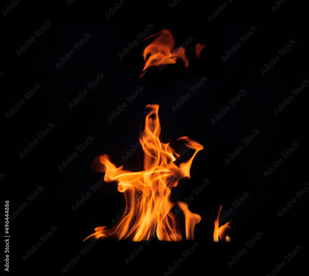 Close up burning flames on black background for graphic design or wallpaper Close up burning flames on black background for graphic design or wallpaper