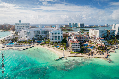 Aerial panoramic view of Cancun beach and city hotel zone in Mexico. Caribbean coast landscape of Mexican resort with beach Playa Caracol and Kukulcan road. Riviera Maya in Quintana roo region on