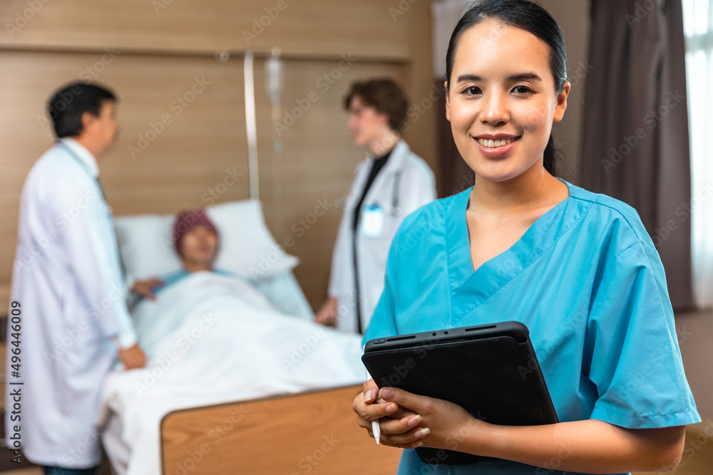 Young Asian woman in medical robe smiling and looking at camera during work against at clinic.Women healthcare medical checkup concept. Young Asian woman in medical robe smiling and looking at camera during work against at clinic.Women healthcare medical checkup concept.