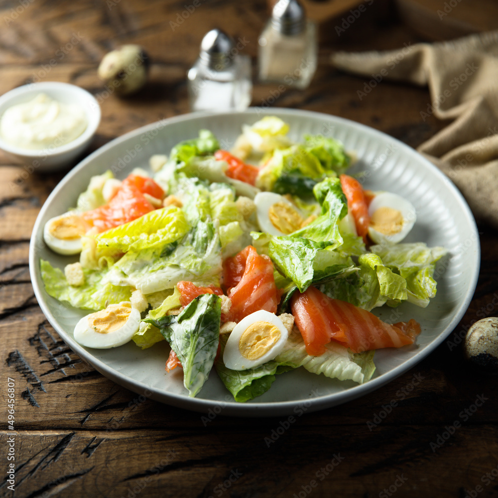 Homemade Caesar salad with salmon Homemade Caesar salad with salmon