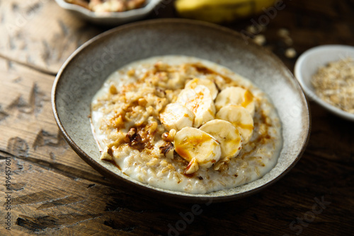 Healthy oatmeal porridge with banana and walnut