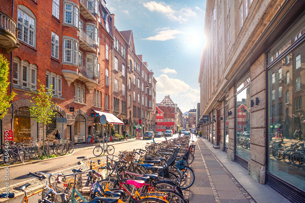 Obraz na płótnie Many parked bikes on a narrow old Minter Street Møntergade in the Old Town of Copenhagen, Denmark w salonie