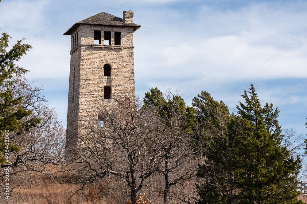 The abandoned water tower rises above the barren trees of fall in Ha Ha Tonka State Park, Missouri
