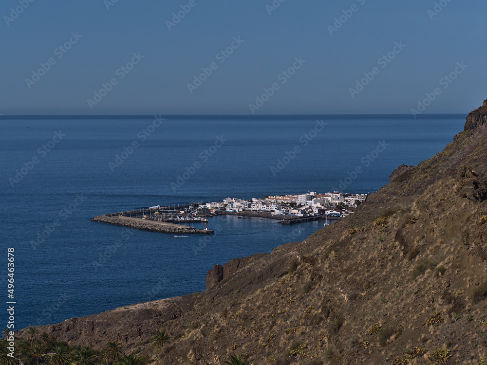 Aerial view over small fishing village Puerto de las Nieves, part of Agaete, on the western coast of island Gran Canaria, Canary Islands, Spain.