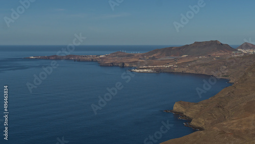 Aerial panoramic view over the northwestern coast of island Gran Canaria, Canary Islands, Spain with village Puerto de las Nieves with mountains.