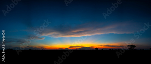 Evening cloudy sky panorama.Panorama Sky clouds with against a setting sun  in Masai Mara, Kenya,africa. photo