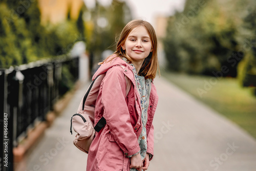Schoolgirl walking at street © tan4ikk