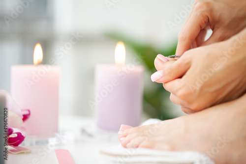 Close up woman making pedicure at her bathroom