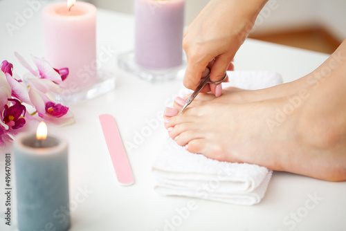 Close up woman making pedicure at her bathroom