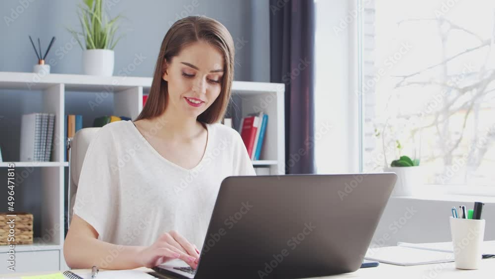 Young Woman Works at Home Office Using Computer. Workplace of Female Entrepreneur, Freelancer or Student. Remote Work and Education Concept. Young Woman Works at Home Office Using Computer. Workplace of Female Entrepreneur, Freelancer or Student. Remote Work and Education Concept.