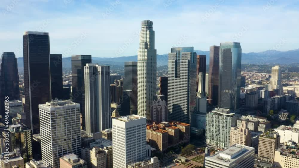 Financial skyscrapers. Business district with skyscrapers. Rising drone shot from residential buildings. Aerial view of cityscape. Urban aerial view of beautiful and scenic downtown Los Angeles. Financial skyscrapers. Business district with skyscrapers. Rising drone shot from residential buildings. Aerial view of cityscape. Urban aerial view of beautiful and scenic downtown Los Angeles.