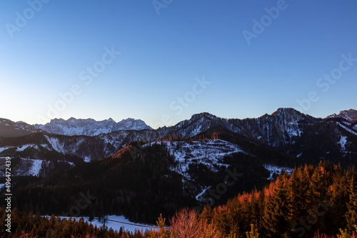 Early morning view on snow capped mountain peaks of Karawanks in Carinthia, Austria. Julian Alps. Scenic view on winter wonderland in the Austrian Alps, Europe. Ski tour, snow shoe hiking. Hochobir