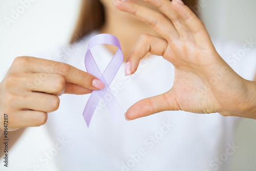 Woman with blue ribbon, prostate cancer awareness
