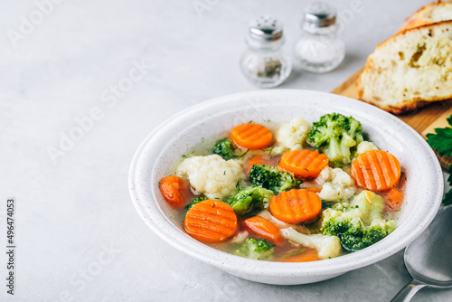 Vegetable soup. Spring broccoli, cauliflower, carrots soup in bowl.