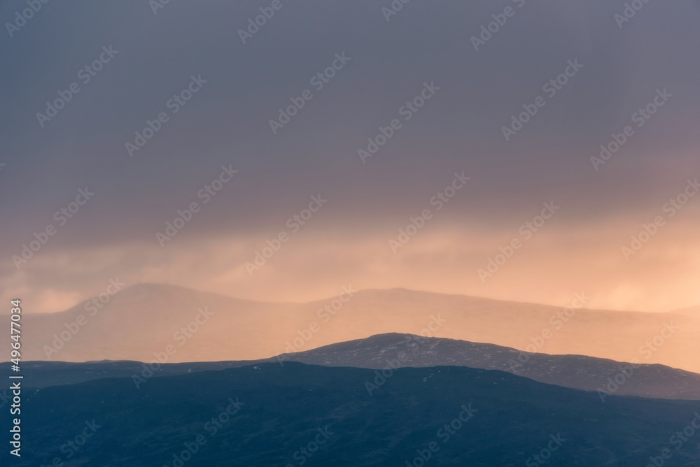 Naklejka premium Epic Winter landscape image of view along Rannoch Moor during heavy rainfall giving misty look to the scene