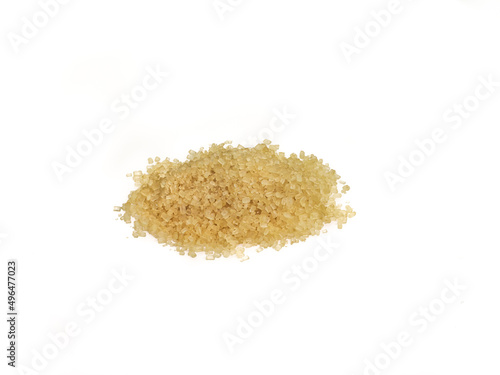 Heap of granulated brown sugar on a white background, macro photo, lots of detail