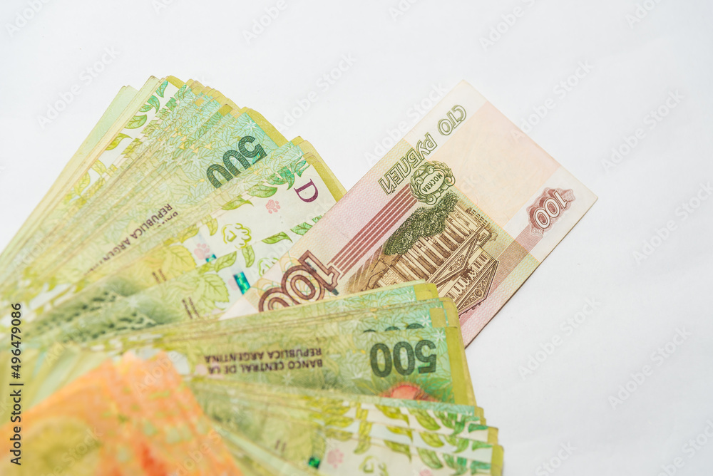 russian ruble peeking through a range of Argentine pesos russian ruble peeking through a range of Argentine pesos