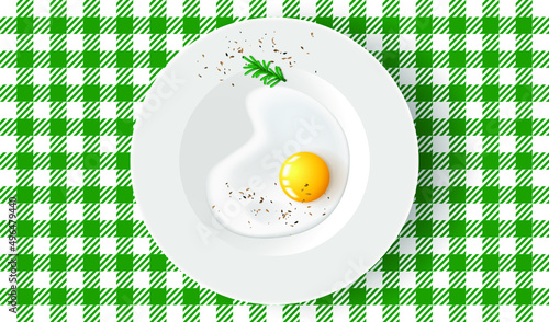 Fried egg with rosemary and pepper on white plate. Breakfast table, top view