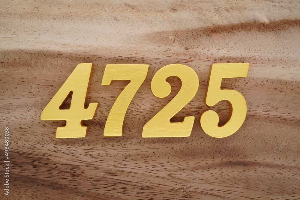 Poster Golden Arabic numerals on a real brown and white wooden floor ...