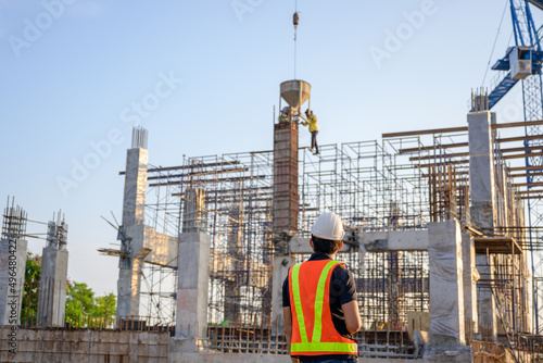 Construction engineers or managers and construction workers on a construction site Project work plan for designing houses and industrial buildings