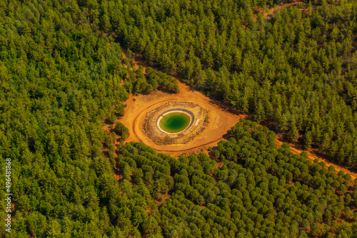 Trees burnt in forest fires of July 2021 in Marmaris resort town of Turkey from helicopter. Beautiful blue bays ans sea