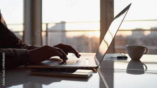 Businessman using laptop computer in office. Young man entrepreneur working at home. Online learning, internet marketing, business studying, working from home, education, web conferencing concept