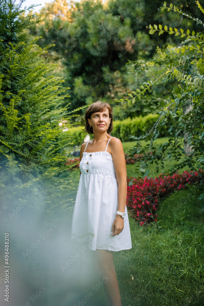 Portrait dreamy and air attractive young woman being playful and carefree with beautiful smile on sunny day. Healthy outdoors lifestyle. Happy female portrait on summer or spring day outside in park. Portrait dreamy and air attractive young woman being playful and carefree with beautiful smile on sunny day. Healthy outdoors lifestyle. Happy female portrait on summer or spring day outside in park.