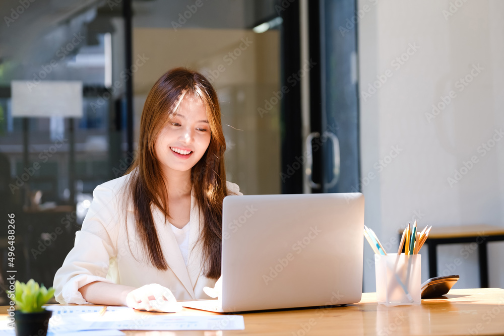 Businesswoman is working at office and using laptop. Businesswoman is working at office and using laptop.