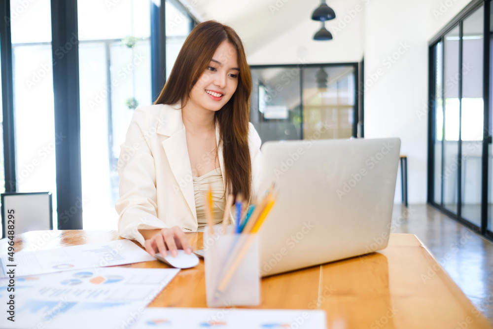 Businesswoman is working at office and using laptop. Businesswoman is working at office and using laptop.