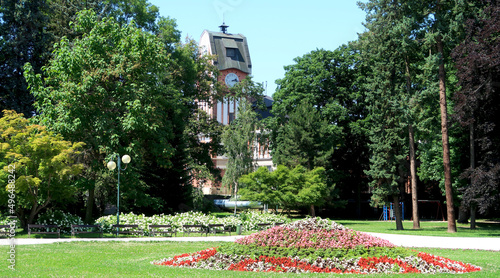 Historic building of hydroelectric power station called Hucak in Hradec Kralove, Czech Republic in the middle of summer. Captured from Jiraskovy sady city park.
