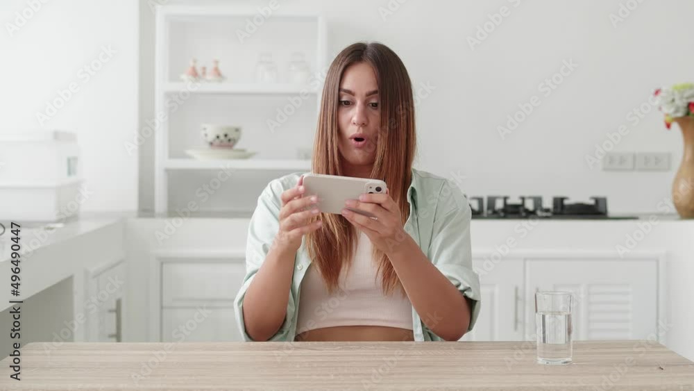 Attractive woman look in smartphone and say wow Attractive woman look in smartphone and say wow