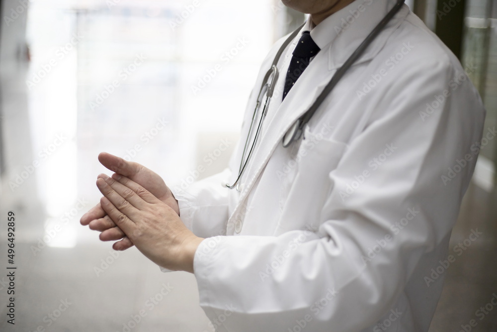 Close up of doctor applauding at hospital Close up of doctor applauding at hospital
