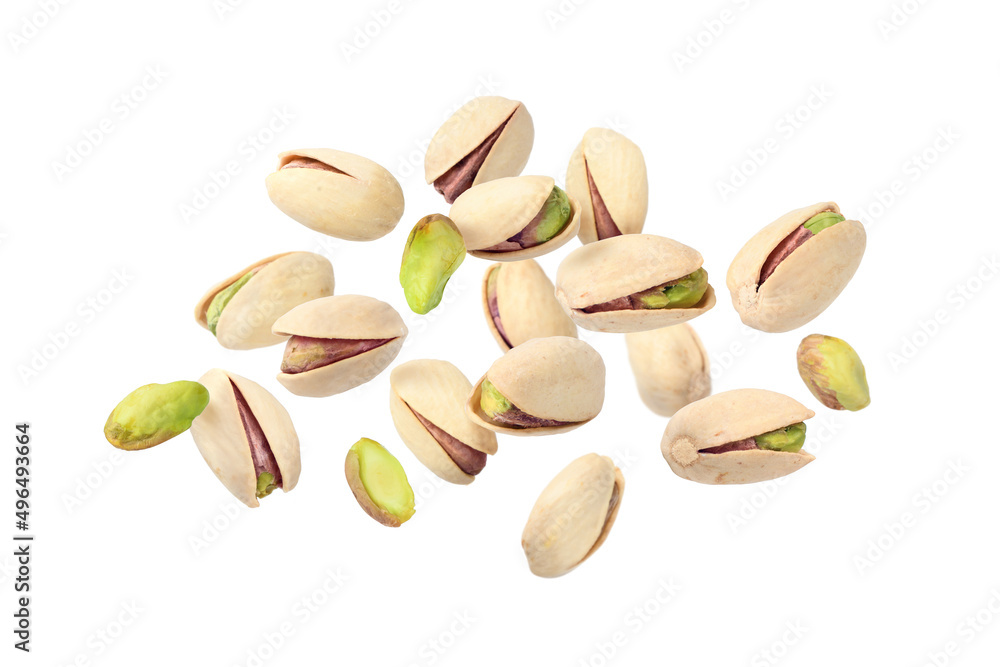 Pistachio floating in the air isolated on a white background. Pistachio floating in the air isolated on a white background.