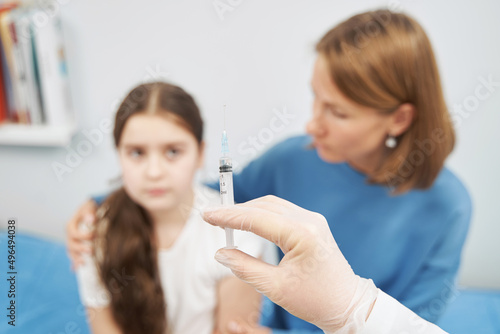 Doctor hand holding medical syringe for injection