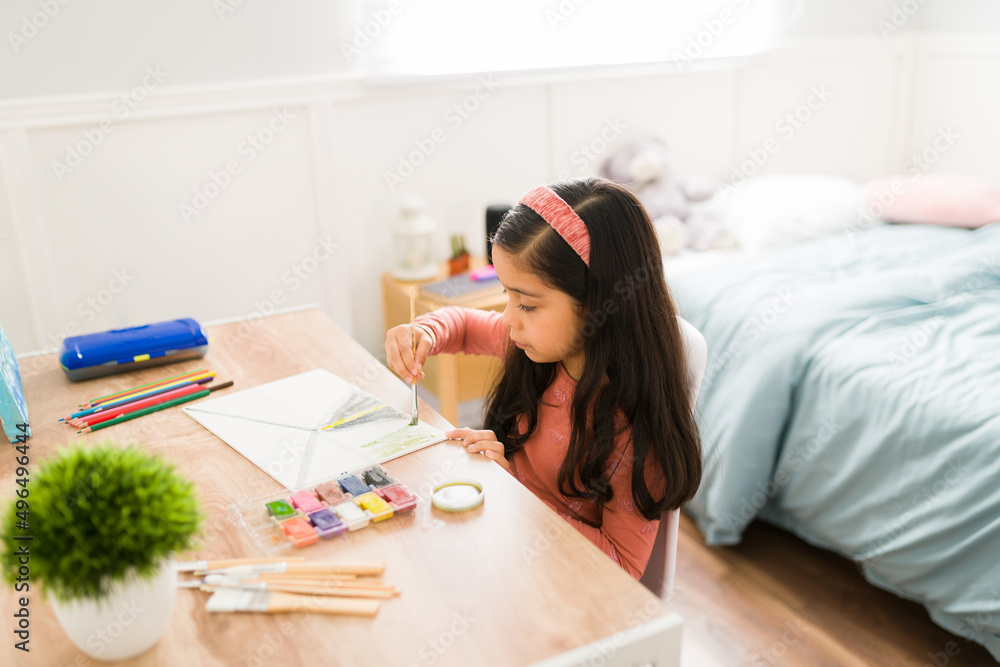Smart girl doing an artistic painting Smart girl doing an artistic painting