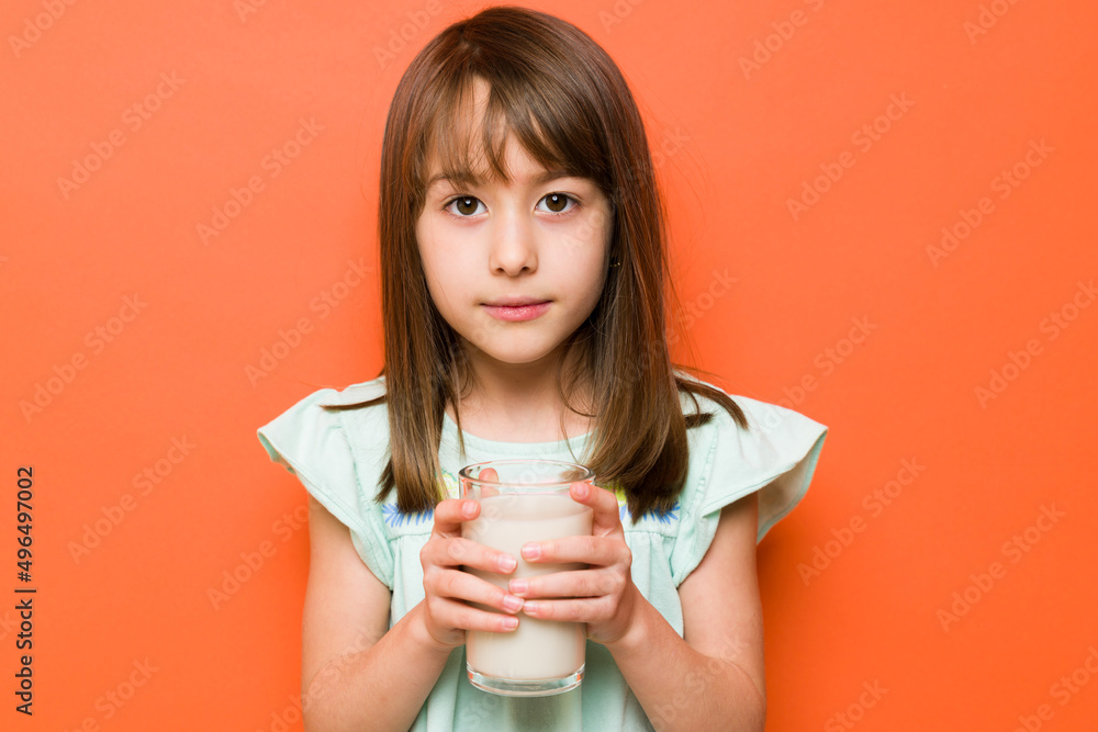 Beautiful brunette drinking some milk Beautiful brunette drinking some milk