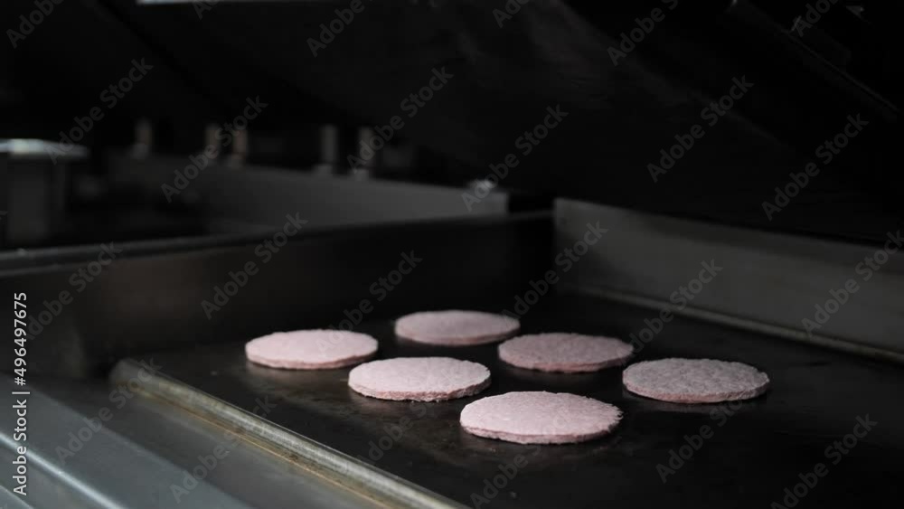 The process of frying meat steak on the stove. Preparation of beef or pork cutlets. Raw burger patty. The process of frying meat steak on the stove. Preparation of beef or pork cutlets. Raw burger patty.