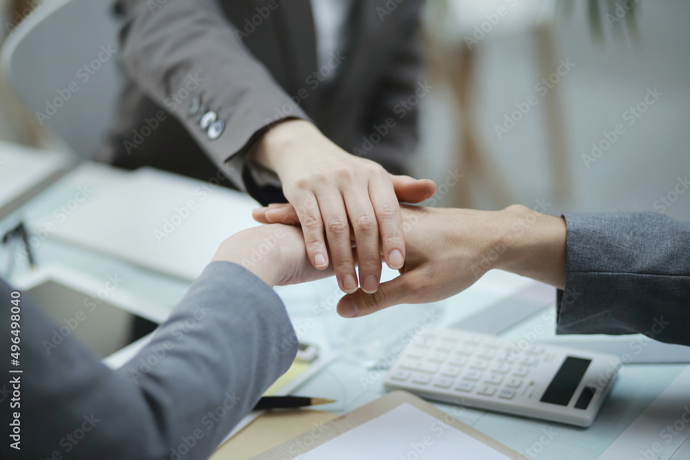 Close-Up Of Business People Stacking Hands