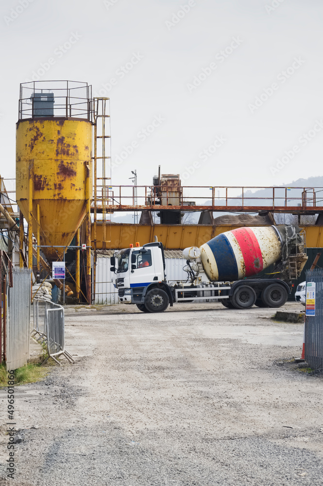 Cement mixing yellow towers and manufacturing site