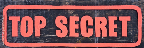 Red text Top secret with frame on dark background