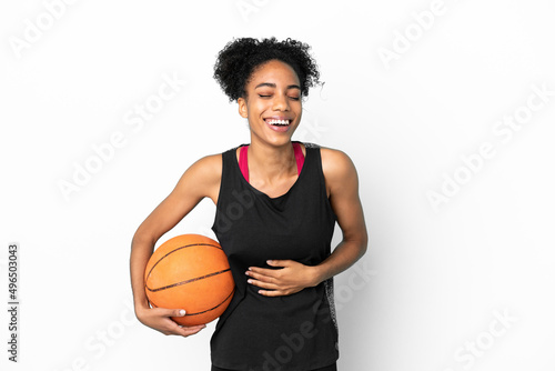 Young basketball player latin woman isolated on white background smiling a lot © luismolinero