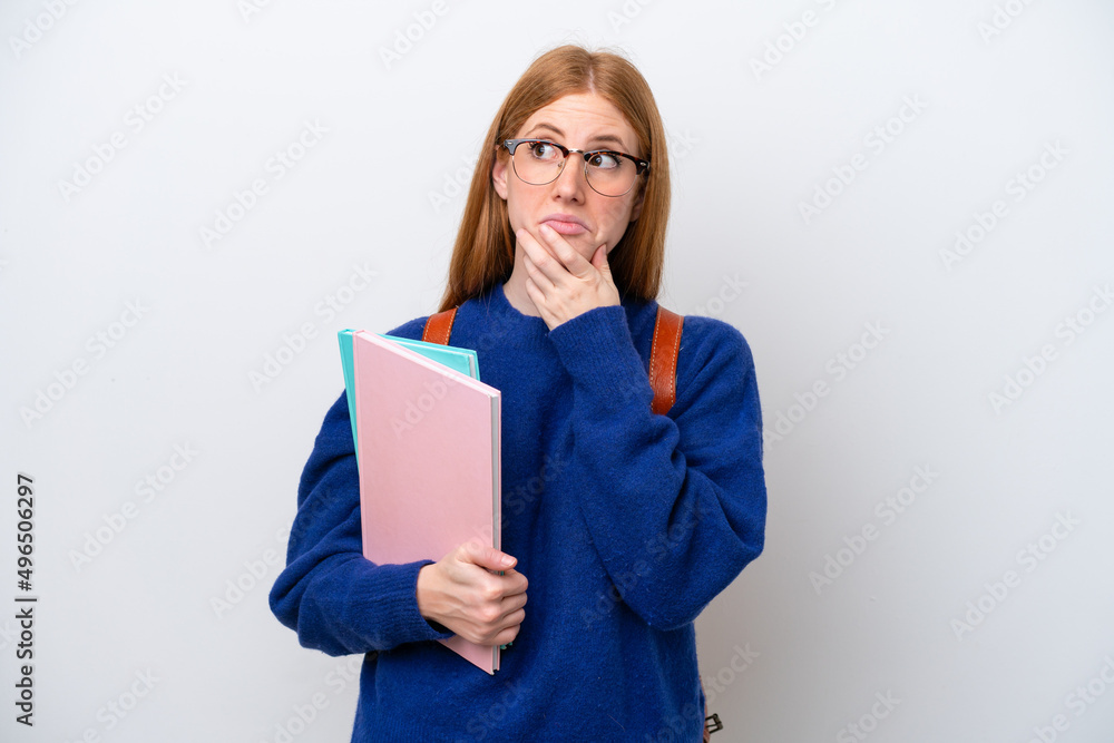 Young student redhead woman isolated on white background having doubts Young student redhead woman isolated on white background having doubts