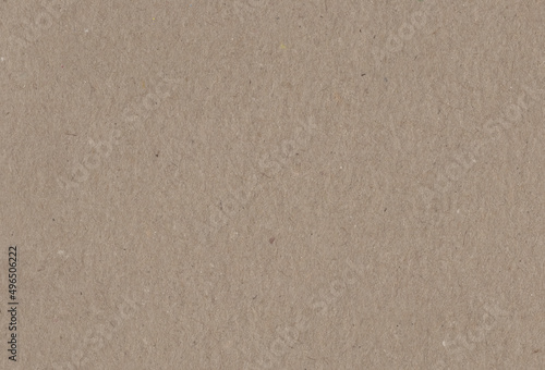 Close up view of textured brown coloured carton paper background.