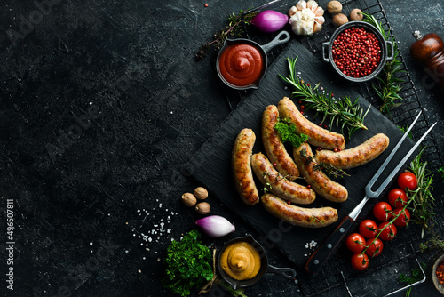 Obraz na płótnie Juicy grilled sausages with turkey meat